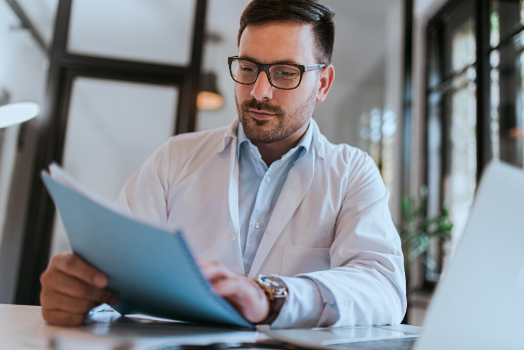 Doctor and healthcare team discussing financial and operational strategies to revitalize a medical practice