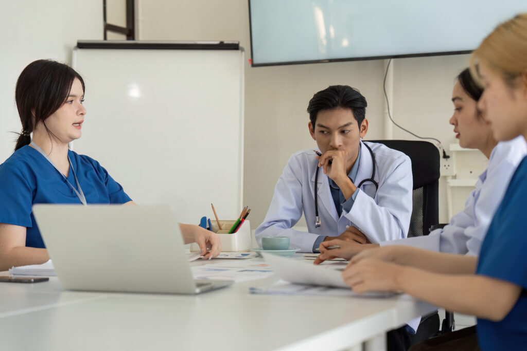 Doctor reviewing business plans for medical practice expansion