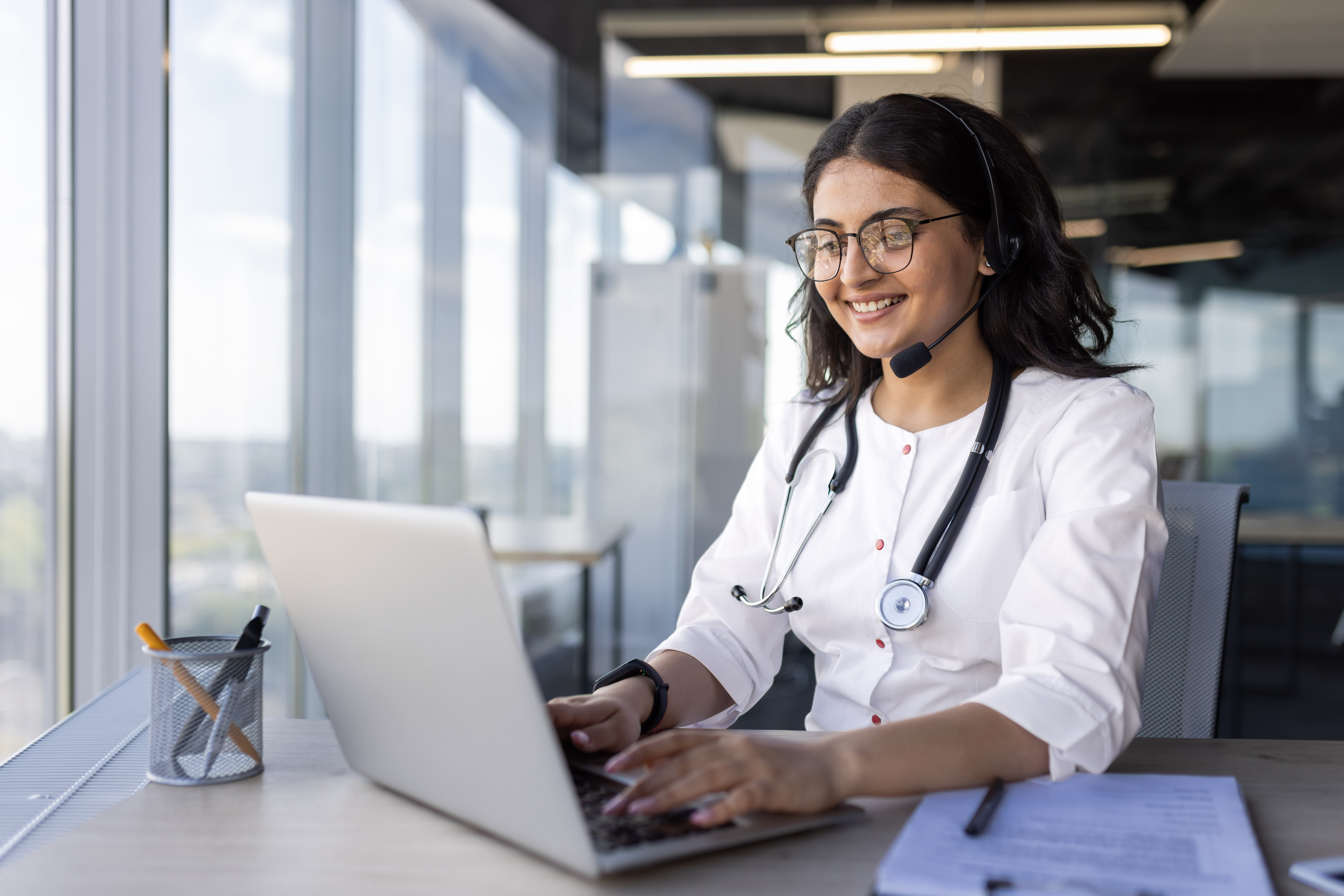 doctor reviewing medical practice workflow charts to identify operational inefficiencies